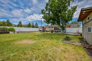 View of yard with a playground and a patio area