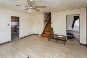 Spare room with ceiling fan and light wood-type flooring