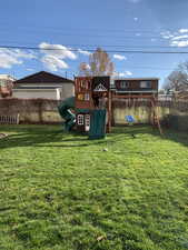 View of yard featuring a playground