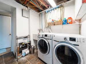 Clothes washing area with washer and clothes dryer