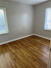 Spare room featuring hardwood / wood-style flooring