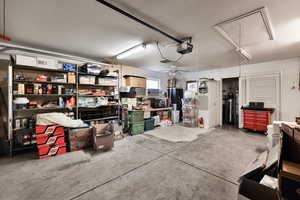 Garage featuring a garage door opener