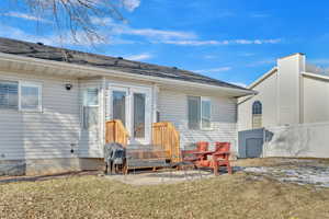 Back of house featuring a yard and a patio