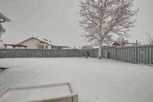 View of yard covered in snow