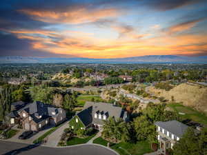 Aerial view at dusk featuring a mountain view