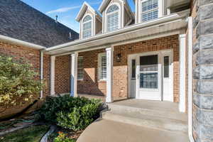 Deep covered porch welcomes guests