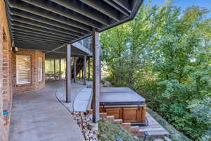 View of patio / terrace with a hot tub