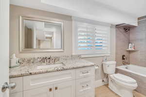 Full bathroom in basement has plenty of natural light