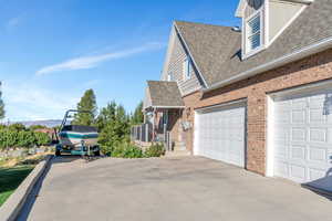 View of side of property with a garage