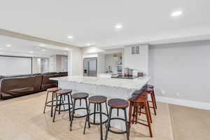 Open concept in basement. Kitchen opens to entertaining space