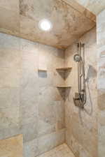 Bathroom featuring a tile shower