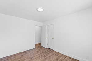 Unfurnished room with light hardwood / wood-style floors