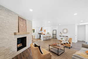 Living room featuring a fireplace and light hardwood / wood-style floors