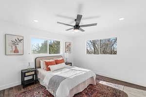 Bedroom with ceiling fan and wood-type flooring