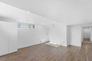 Spare room with hardwood / wood-style flooring and a textured ceiling