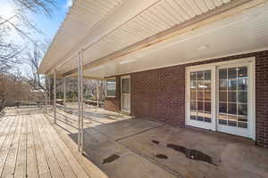 Wooden terrace with a patio area