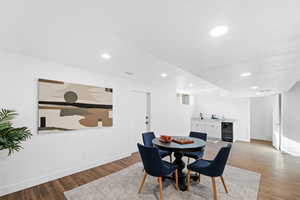 Dining room featuring wine cooler and light hardwood / wood-style flooring