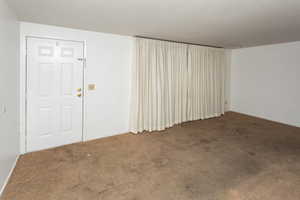 Spare room with dark carpet