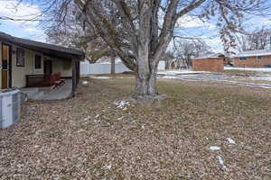 View of yard featuring cooling unit and a patio area