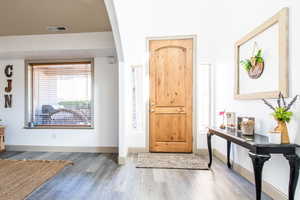 Entrance foyer featuring hardwood / wood-style floors