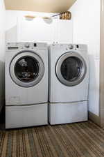 Clothes washing area with cabinets and washing machine and clothes dryer