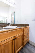 Bathroom with vanity and wood-type flooring