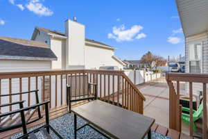 Deck featuring central AC, a residential view, a patio, and a fenced backyard
