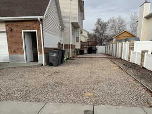 View of property exterior featuring a garage