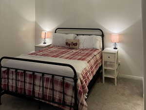 Bedroom featuring carpet, lofted ceiling, and ceiling fan