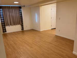 Unfurnished room featuring light wood-type flooring