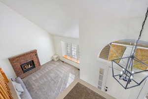Living room featuring a fireplace and carpet