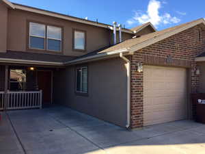 View of side of property with a garage