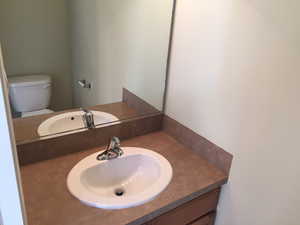 Bathroom featuring vanity and toilet