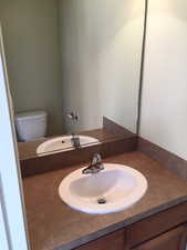 Bathroom with vanity and toilet