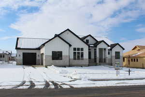 View of front of property featuring a garage