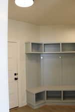 Mudroom with hardwood / wood-style floors