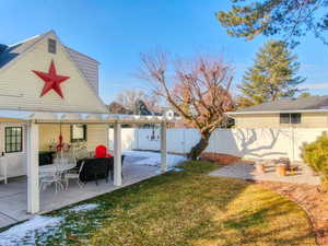 View of yard featuring a pergola and a patio area