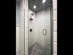 Bathroom featuring walk in shower