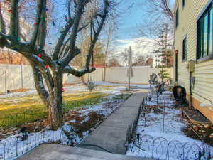 View of yard covered in snow