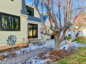 View of snow covered property entrance