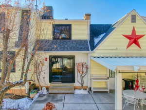 Rear view of property featuring a patio and central air condition unit