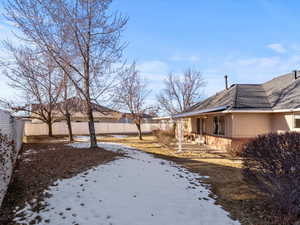 View of yard layered in snow