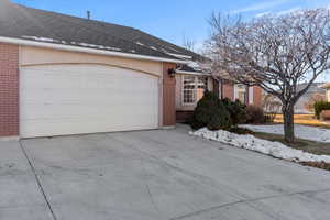 View of side of home with a garage