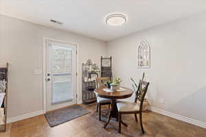 Dining room featuring tile patterned flooring