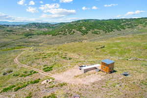 Birds eye view of property with a rural view and a mountain view