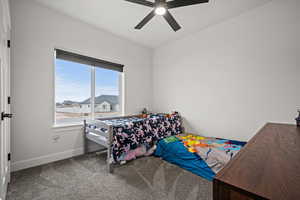 Bedroom with carpet and ceiling fan