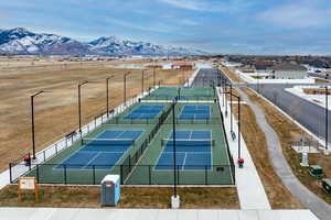 View of tennis court with a mountain view