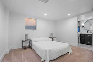 Bedroom with light colored carpet