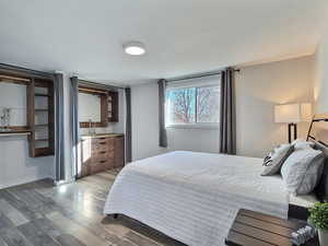 Bedroom featuring wood-type flooring