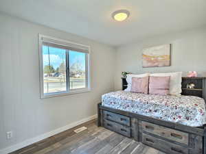 Bedroom featuring wood-type flooring